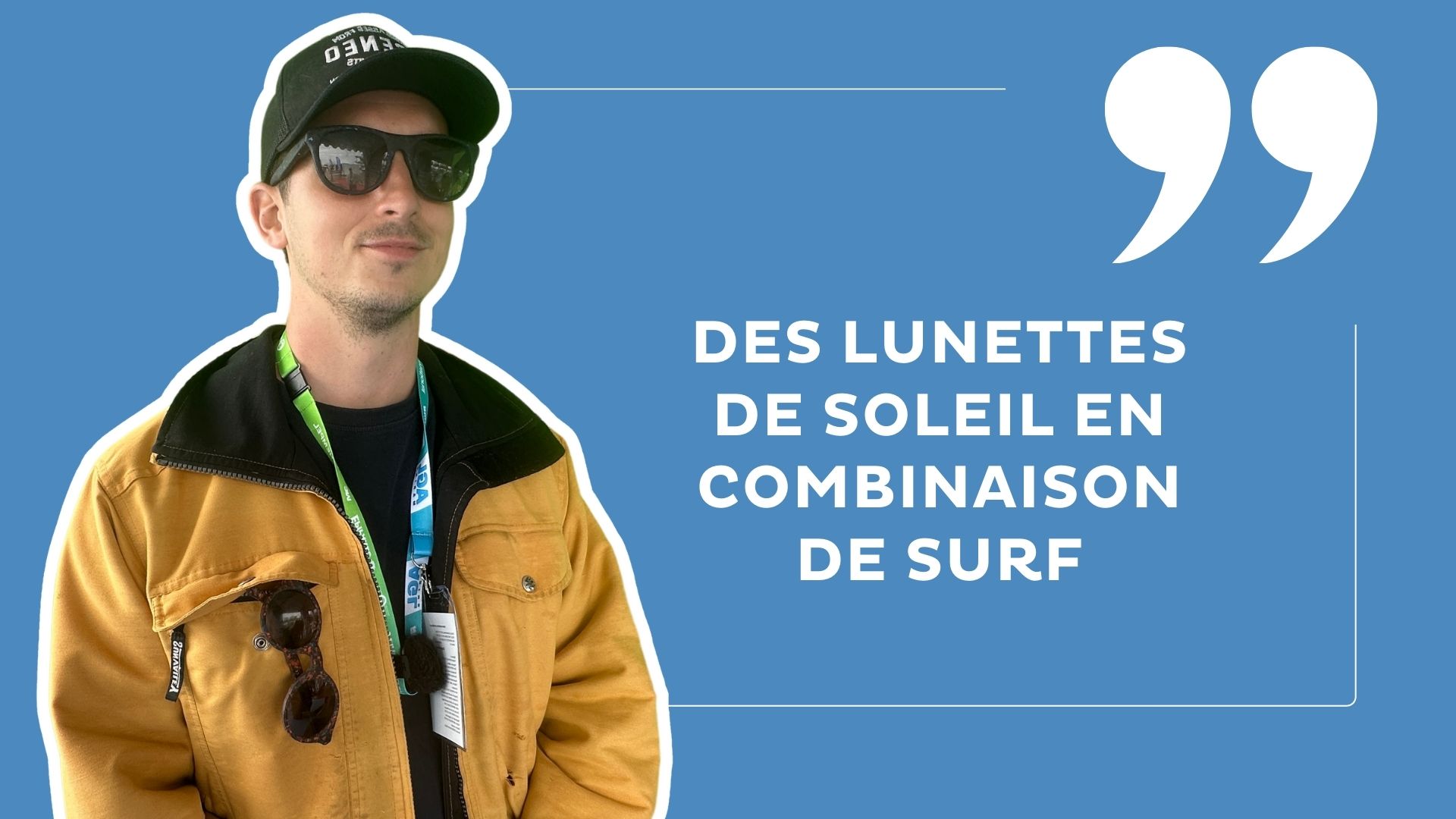 marco midrouillet en itw sur fond bleu. Il porte un manteau jaune et des lunettes de soleil Océnéo.